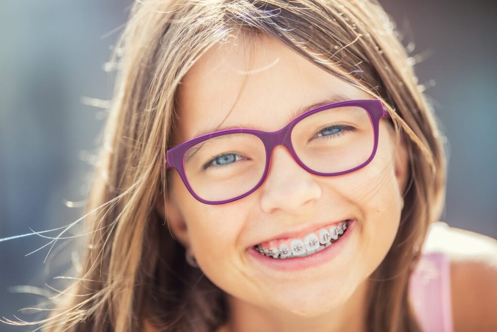 young-cute-caucasian-blond-girl-wearing-teeth-braces-glasses